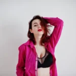 red-haired-girl-with-big-bust-black-bra-rose-shirt