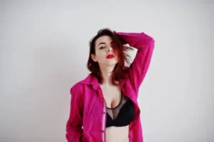 red-haired-girl-with-big-bust-black-bra-rose-shirt
